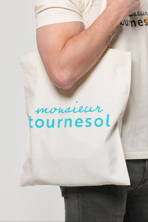 Sac de courses tote bag Monsieur Tournesol couleur blanc naturel avec inscription Monsieur Tournesol en bleu cyan.